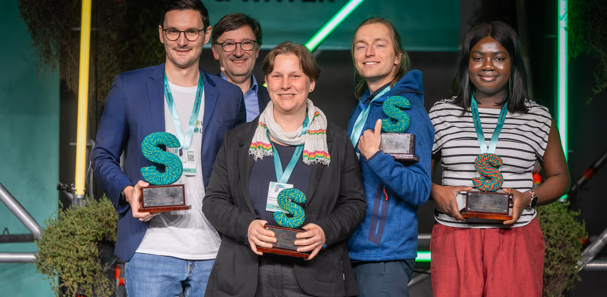 Power2Polymers team on stage with the Impact Festival main prize